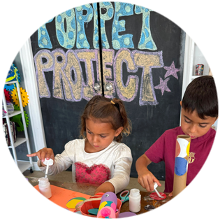 Children creating art at The Poppet Project Miami / El Portal
